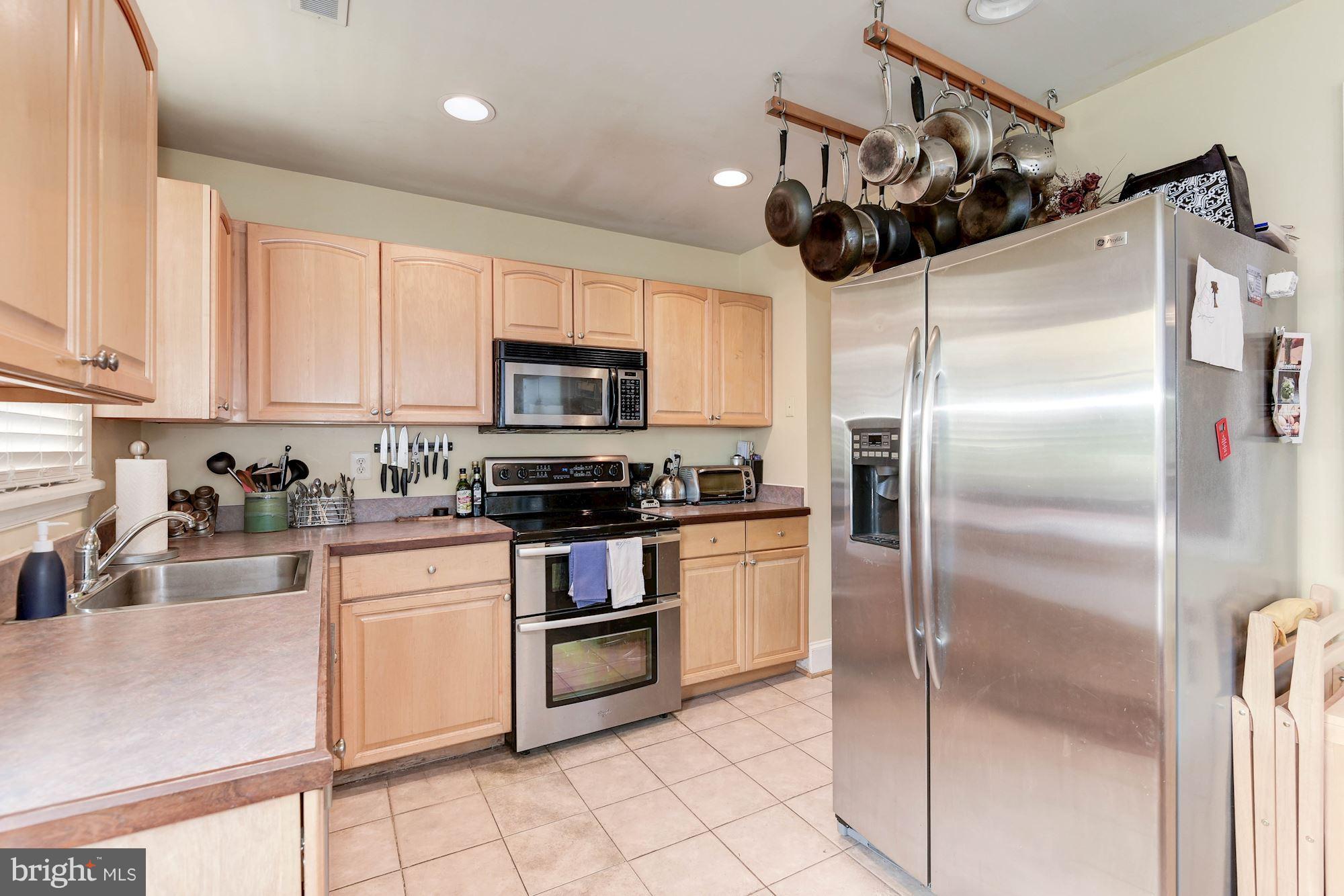 349 Kentucky Avenue Southeast Washington, DC 20003 - Photo 9 of 29 a kitchen with kitchen island a counter top space appliances and cabinets