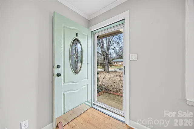 a bathroom with a granite countertop mirror and a shower