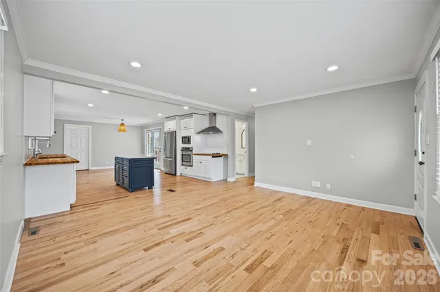 a view of kitchen with cabinets and wooden floor