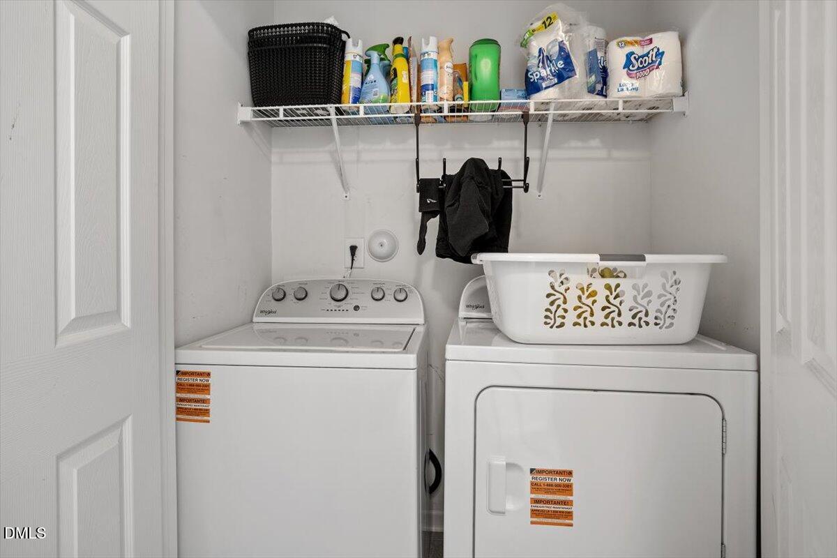 1409 Oxleymare Drive Raleigh, NC 27610 - Photo 26 of 28 a utility room with dryer and washer