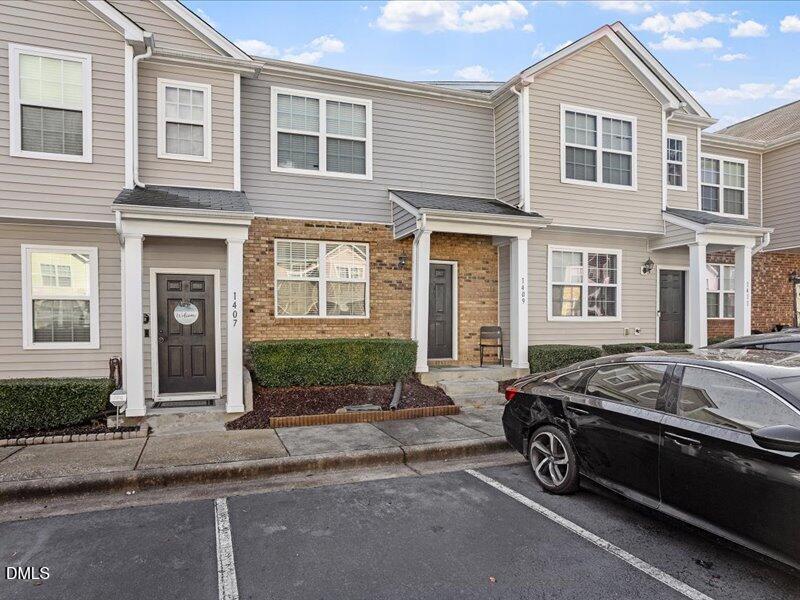 1409 Oxleymare Drive Raleigh, NC 27610 - Photo 4 of 28 a front view of a house with a garden