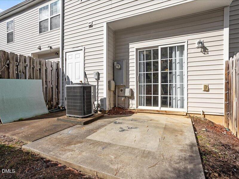 1409 Oxleymare Drive Raleigh, NC 27610 - Photo 6 of 28 a view of a house with a parking area