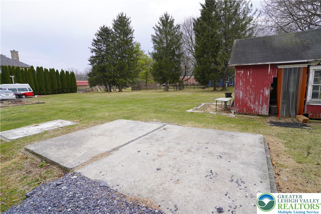 3863 Mauch Chunk Road Coplay, PA 18037 - Photo 31 of 33 a view of a house with backyard and trees