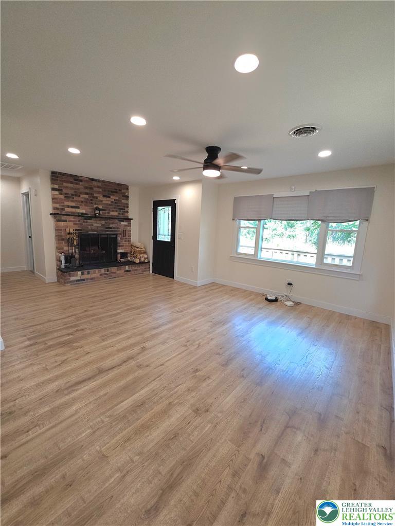 89 Short Ridge Road Albrightsville, PA 18210 - Photo 18 of 71 An inviting wood-floored living space centers on a classic brick hearth.