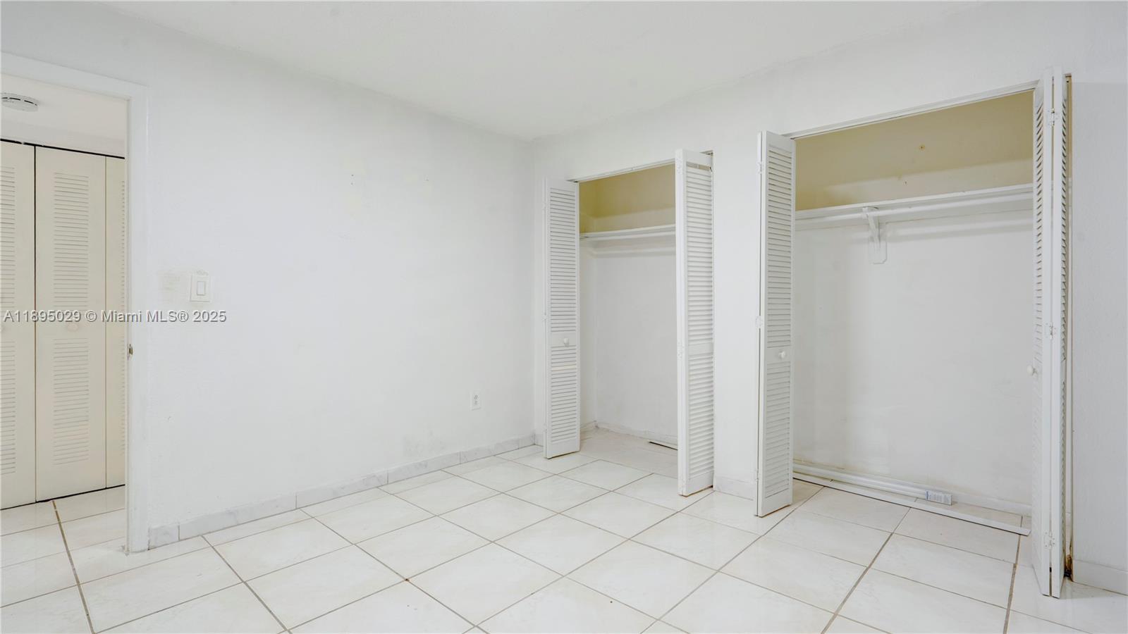 10000 Northwest 80th Court, Unit 2214 Hialeah Gardens, FL 33016 - Photo 15 of 21 a view of an empty room