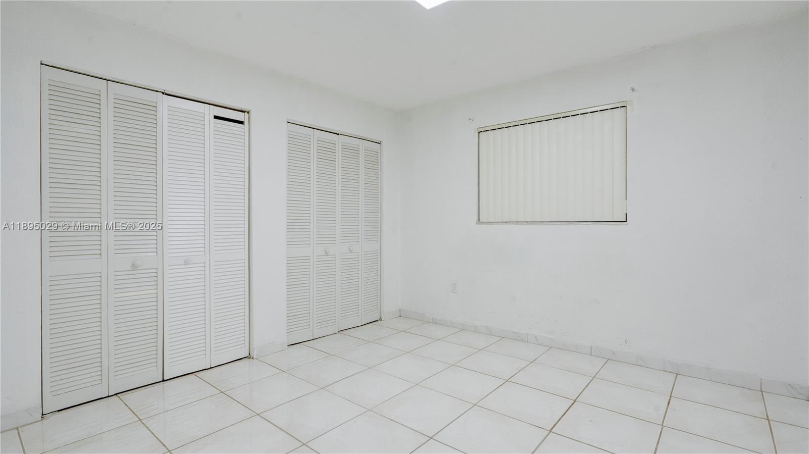 10000 Northwest 80th Court, Unit 2214 Hialeah Gardens, FL 33016 - Photo 18 of 21 a view of an empty room