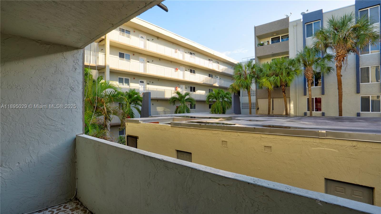 10000 Northwest 80th Court, Unit 2214 Hialeah Gardens, FL 33016 - Photo 19 of 21 a view of outdoor space and swimming pool