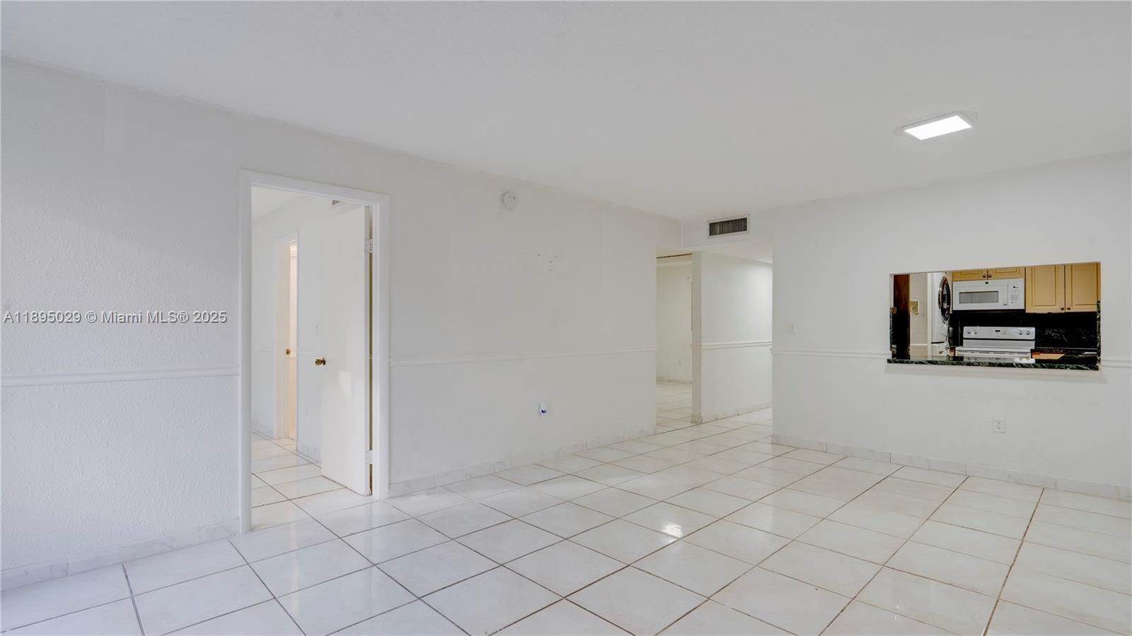 10000 Northwest 80th Court, Unit 2214 Hialeah Gardens, FL 33016 - Photo 5 of 21 a view of an empty room