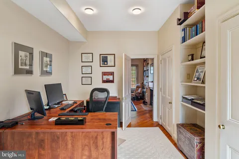 a bedroom with furniture and a book shelf