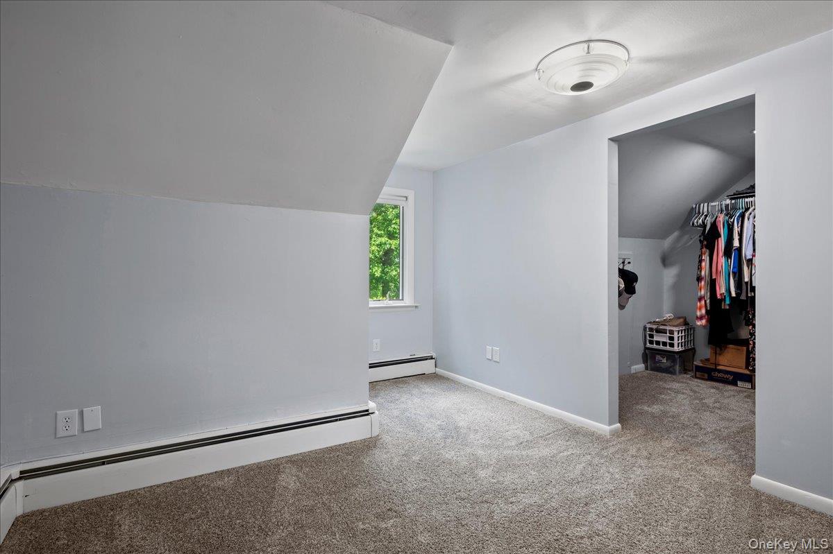 105 High St Extension Mount Kisco, NY 10549 - Photo 33 of 38 an empty room with closet and windows