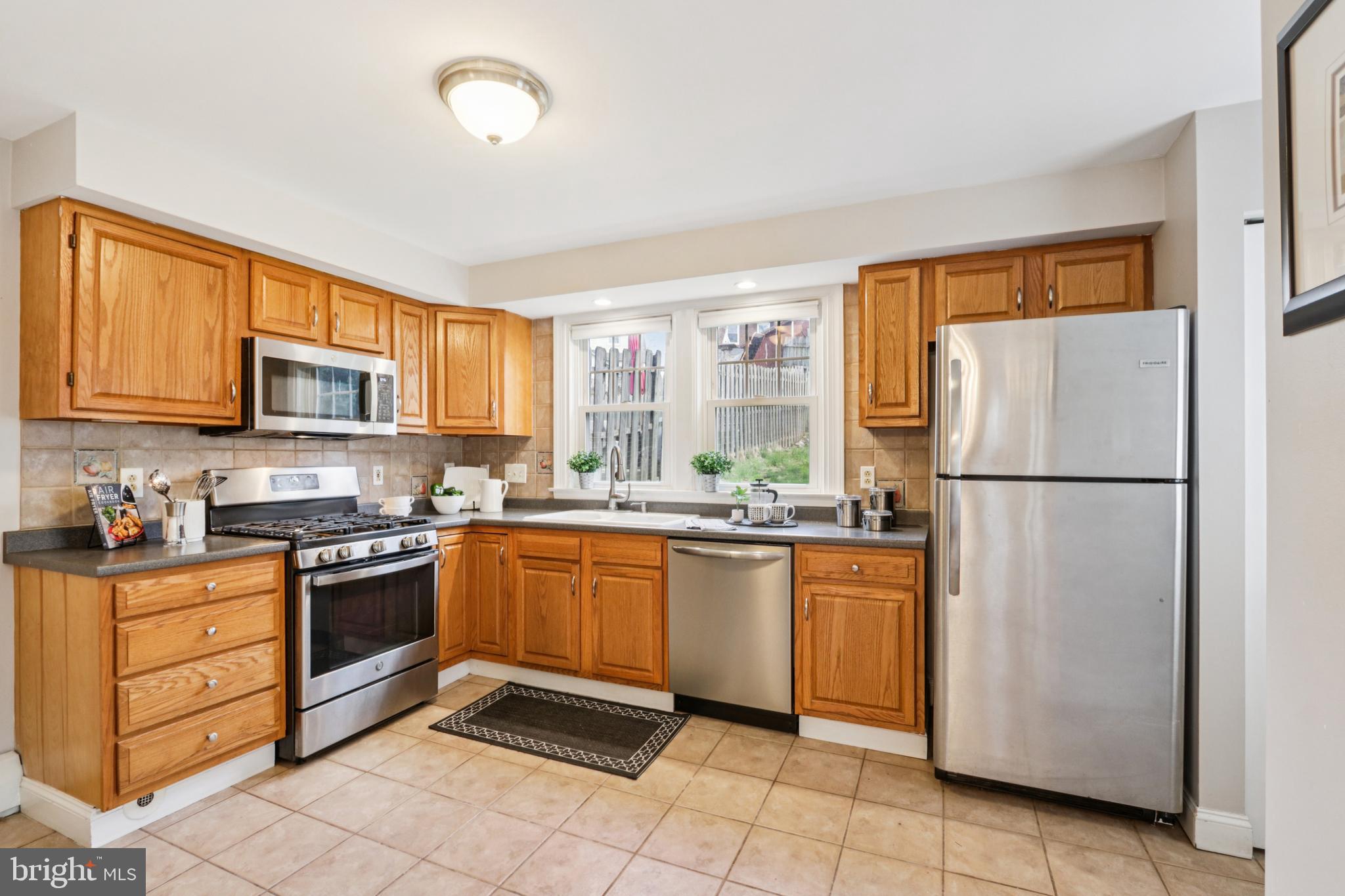 205 North Aberdeen Avenue Wayne, PA 19087 - Photo 11 of 46 a kitchen with granite countertop stainless steel appliances a refrigerator sink and microwave