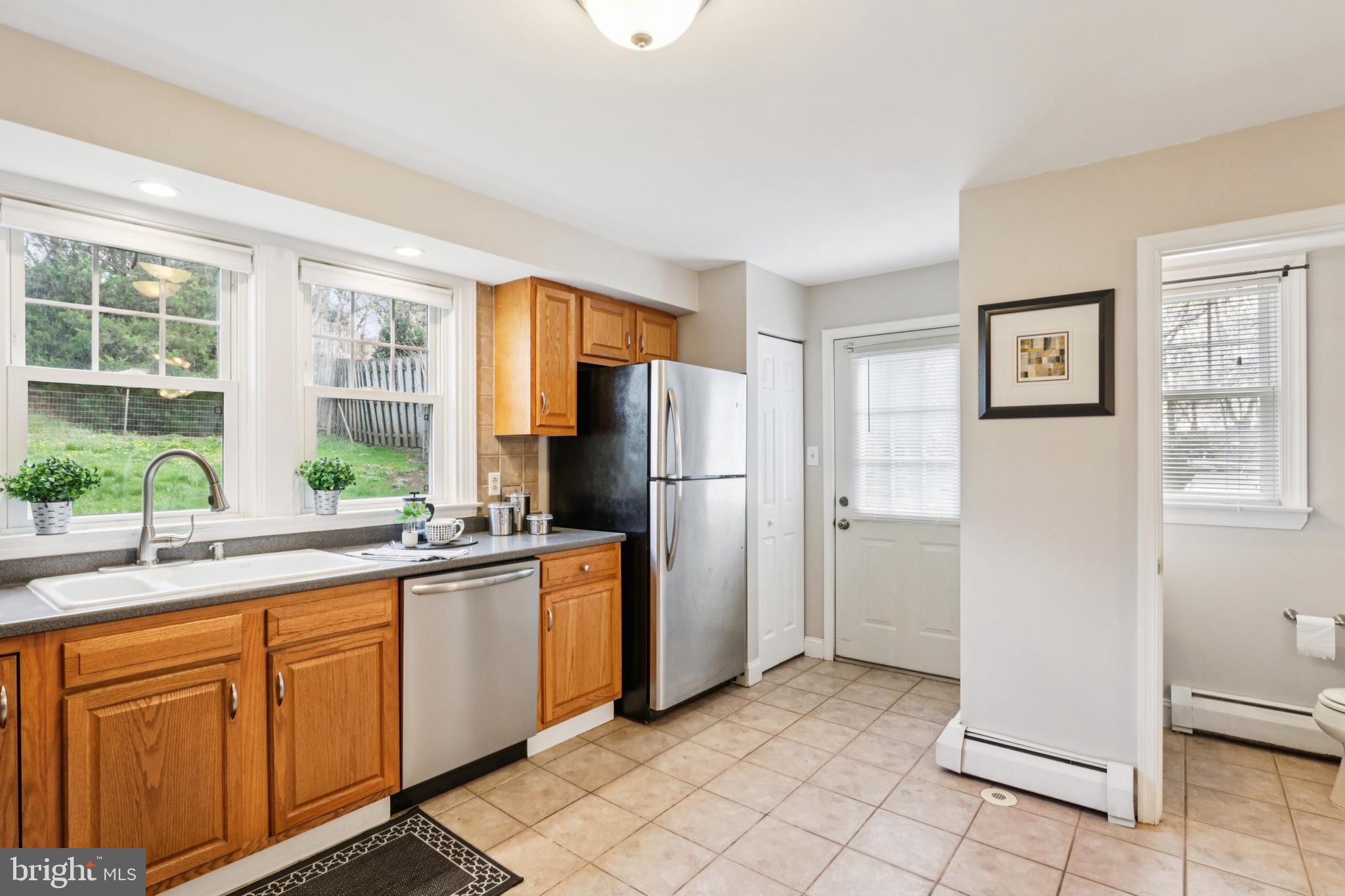 205 North Aberdeen Avenue Wayne, PA 19087 - Photo 13 of 46 a kitchen with a sink refrigerator and window