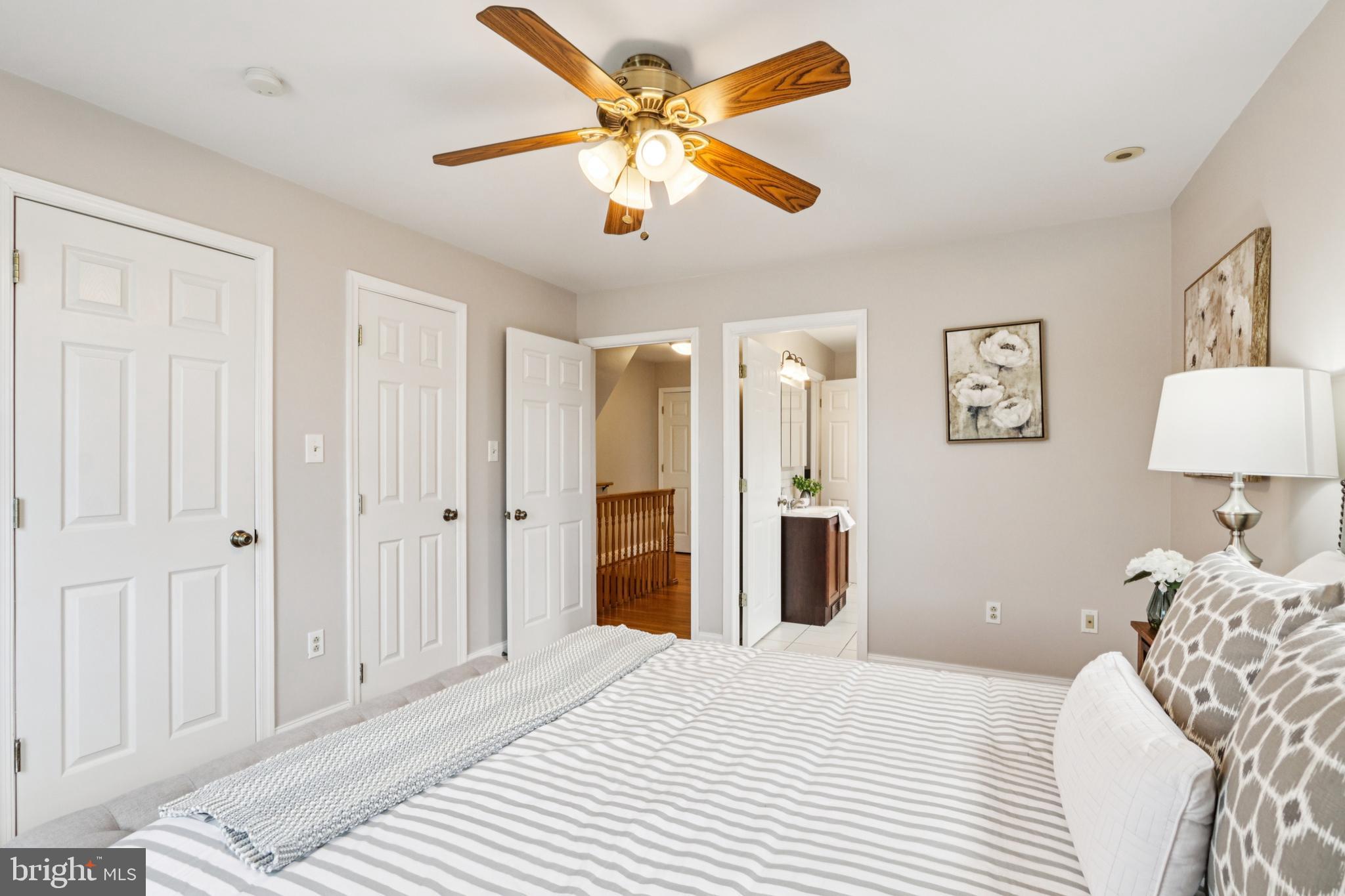 205 North Aberdeen Avenue Wayne, PA 19087 - Photo 23 of 46 a bedroom with a bed and a chandelier