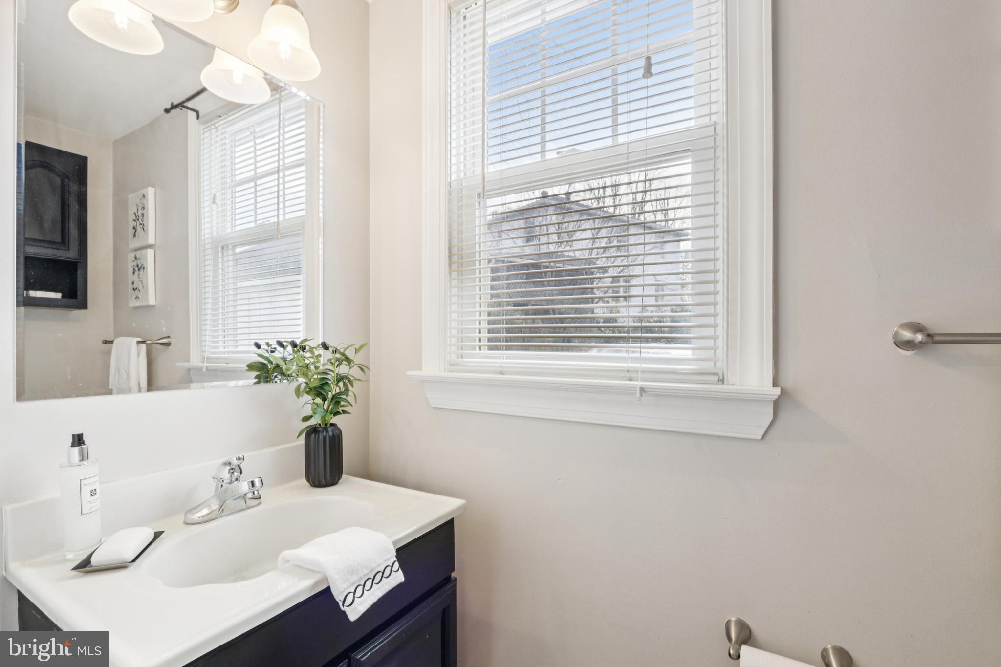 205 North Aberdeen Avenue Wayne, PA 19087 - Photo 27 of 46 a bathroom with a sink and a mirror