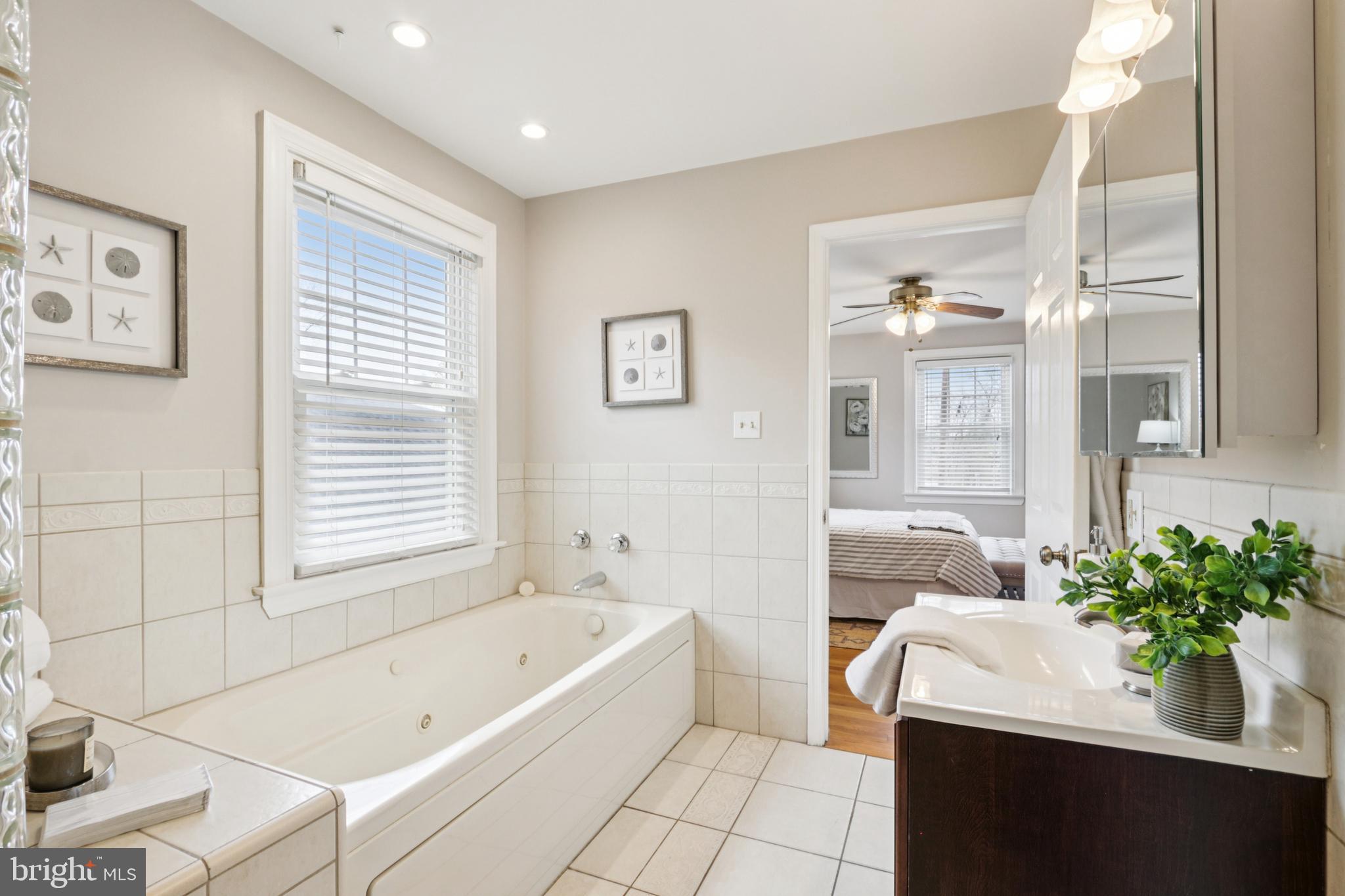 205 North Aberdeen Avenue Wayne, PA 19087 - Photo 30 of 46 a bathroom with a bathtub sink and mirror with shower