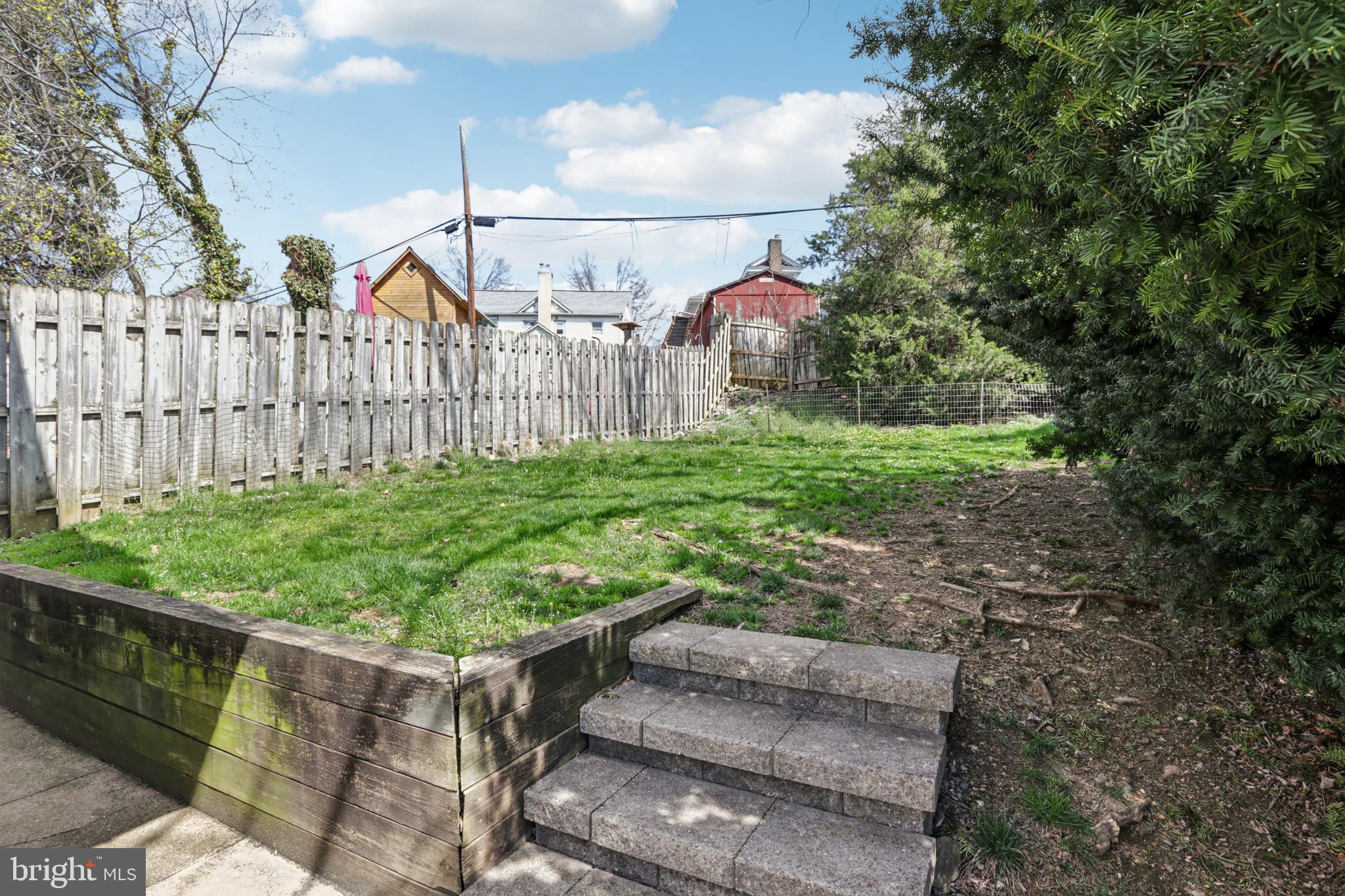 205 North Aberdeen Avenue Wayne, PA 19087 - Photo 35 of 46 a view of a backyard with wooden fence
