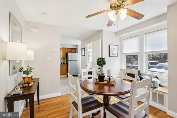 a kitchen with a sink refrigerator and window