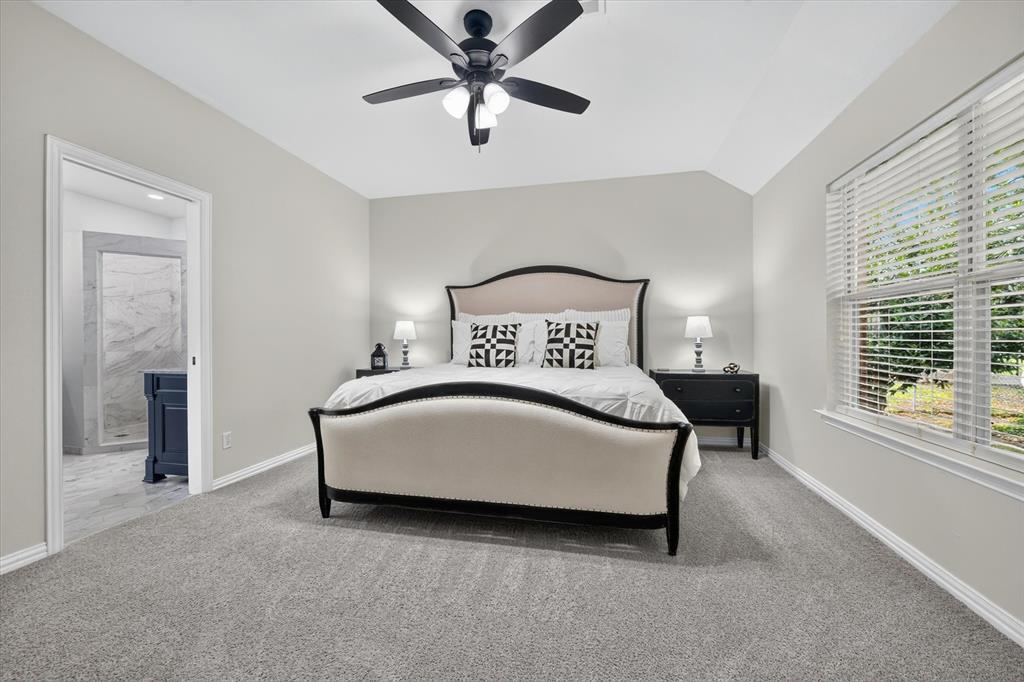 421 Ben Boyd Road Argyle, TX 76226 - Photo 9 of 25 Spacious room featuring vaulted ceilings and neutral-toned carpeting