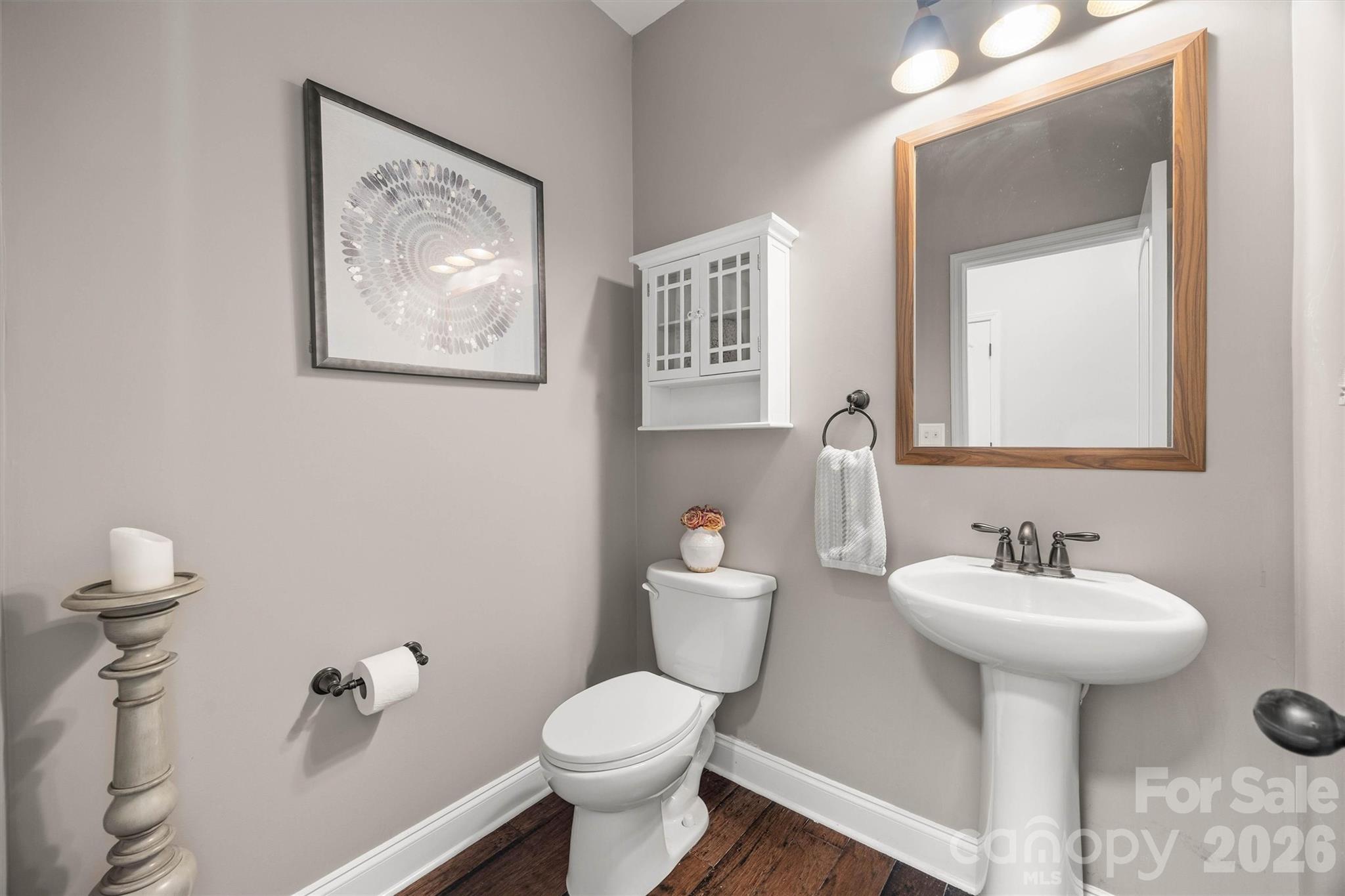 299 Annatto Way Tega Cay, SC 29708 - Photo 20 of 46 a bathroom with a toilet sink and mirror