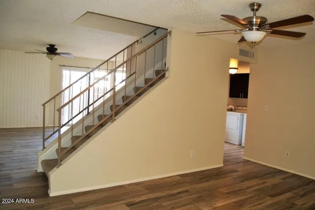 a view of an empty room and a window