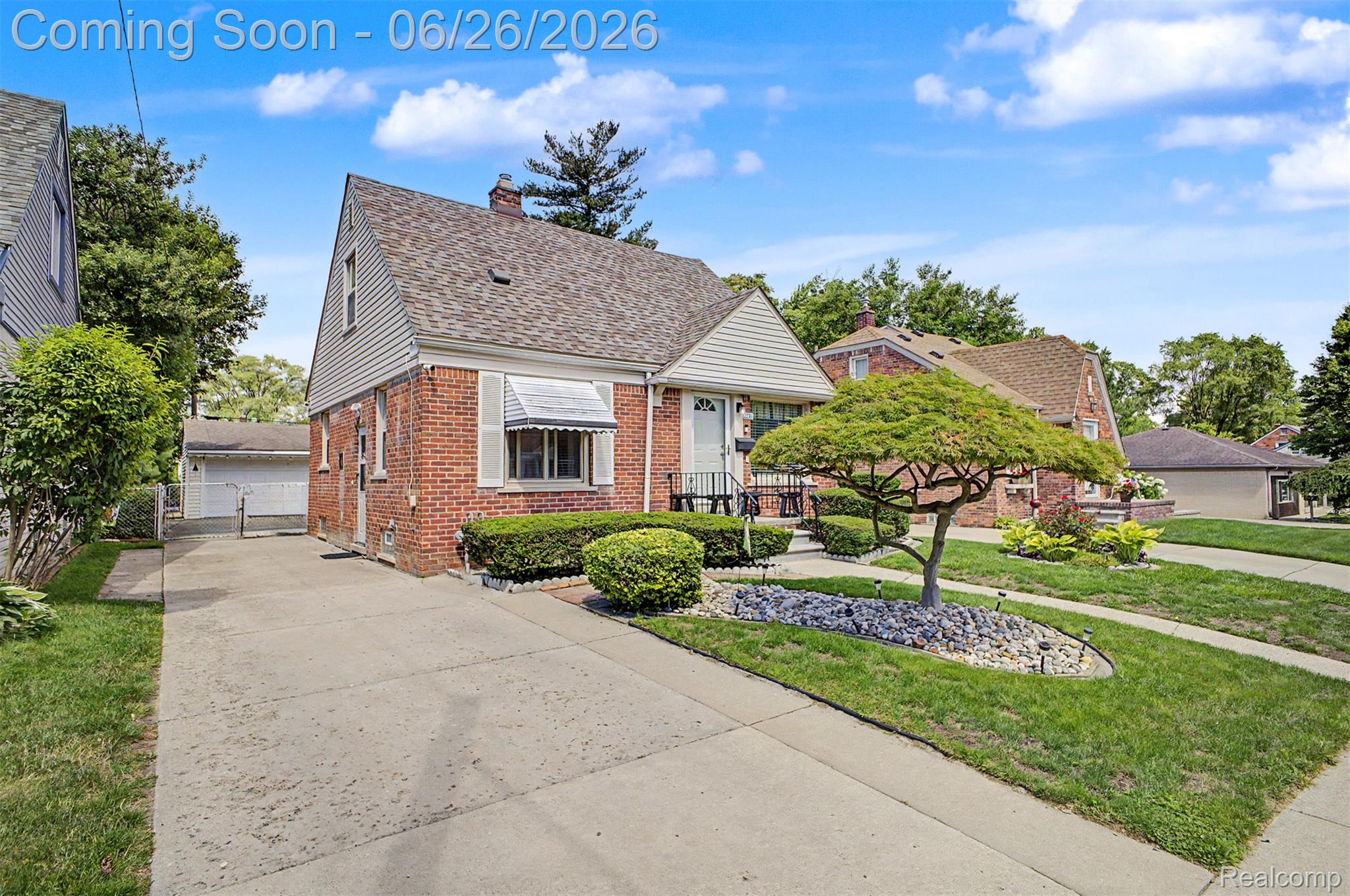 2216 Banner Street Dearborn, MI 48124 - Photo 2 of 34 Brick exterior with white siding accents and a shingle roof