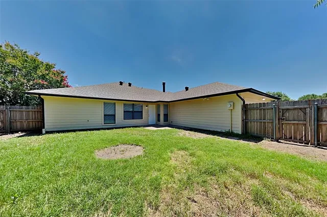 a view of a backyard of the house