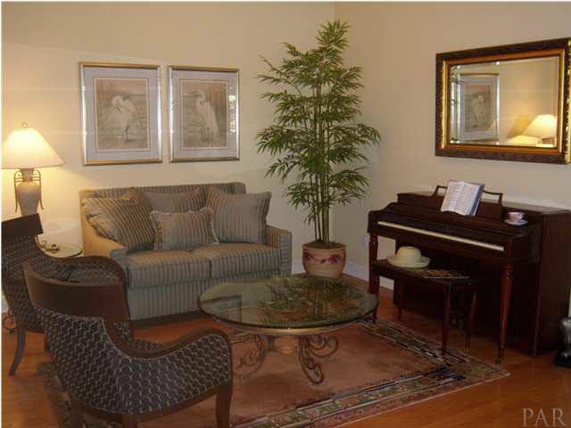 10184 Bittern Drive Pensacola, FL 32507 - Photo 4 of 24 Relax in the great room in front of the fireplace as you listen to the surround sound system.