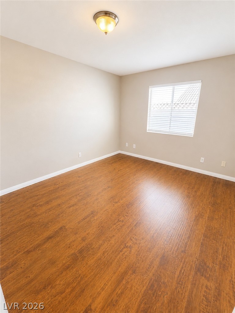 7213 London Bridge Avenue Las Vegas, NV 89130 - Photo 9 of 11 This bright room features beautiful flooring, creating a warm and inviting atmosphere.