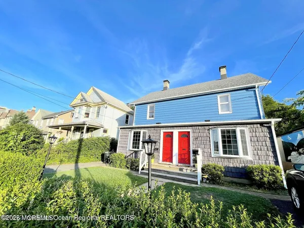front view of a house with a yard
