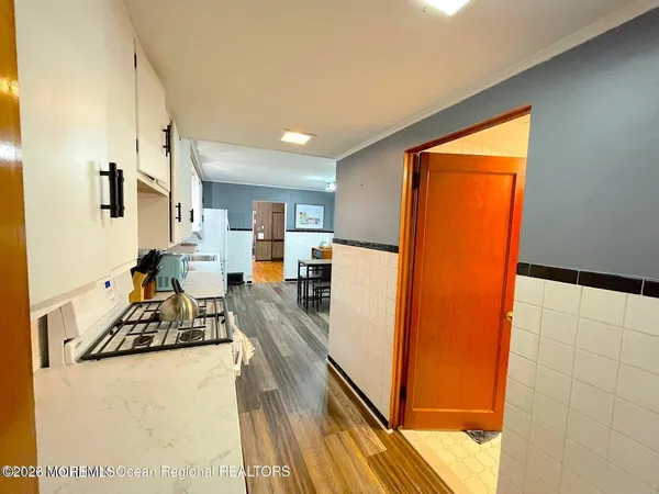 a bathroom with a shower a bathtub and toilet