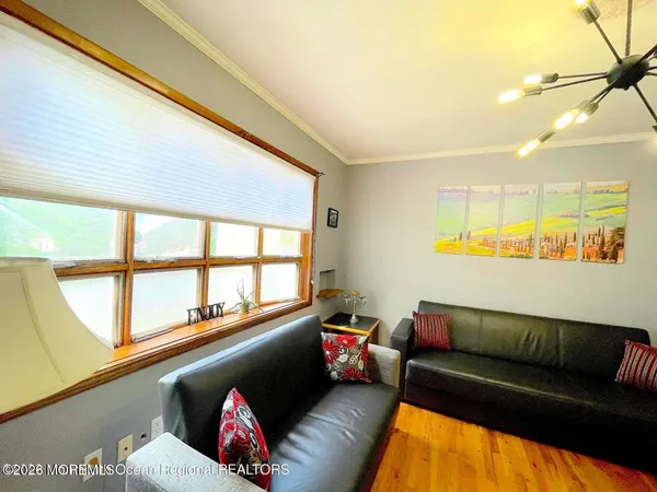 a room with pool table and flat screen tv