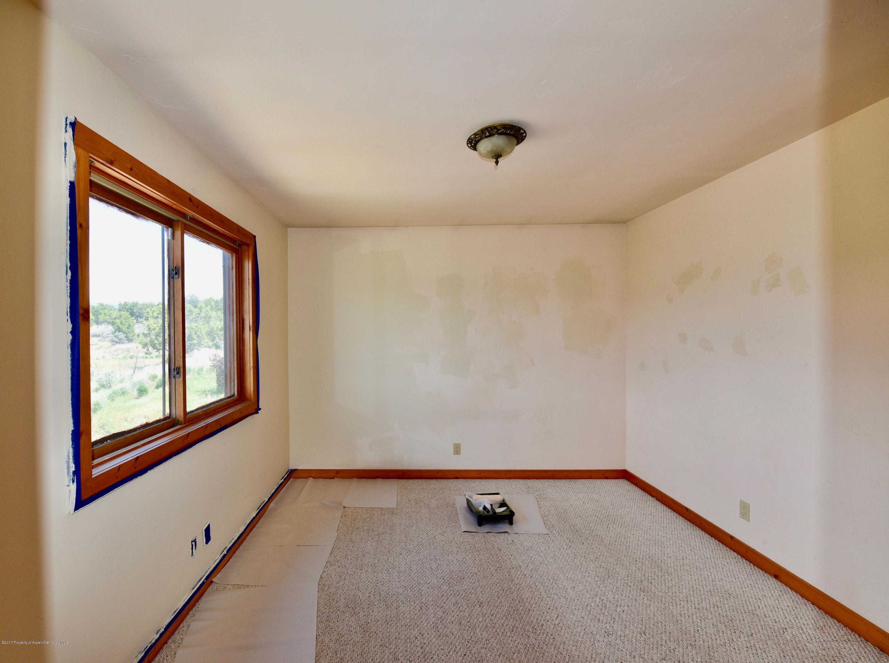 3744 County Road 237 Rifle, CO 81650 - Photo 23 of 37 an empty room with a window