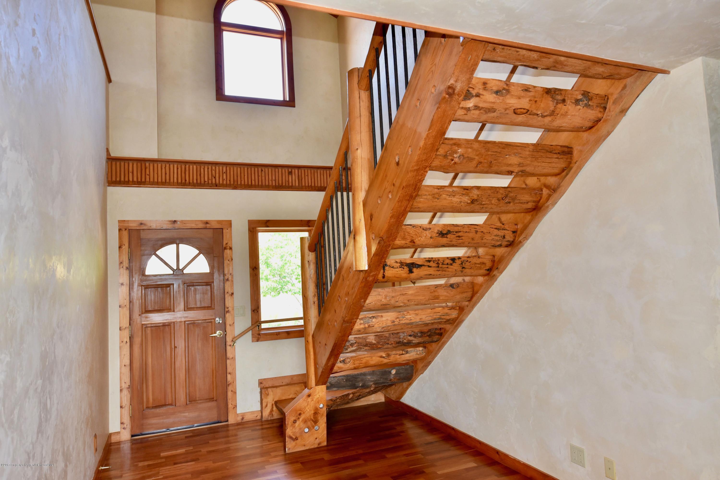 3744 County Road 237 Rifle, CO 81650 - Photo 29 of 37 a view of an entryway with wooden floor and door