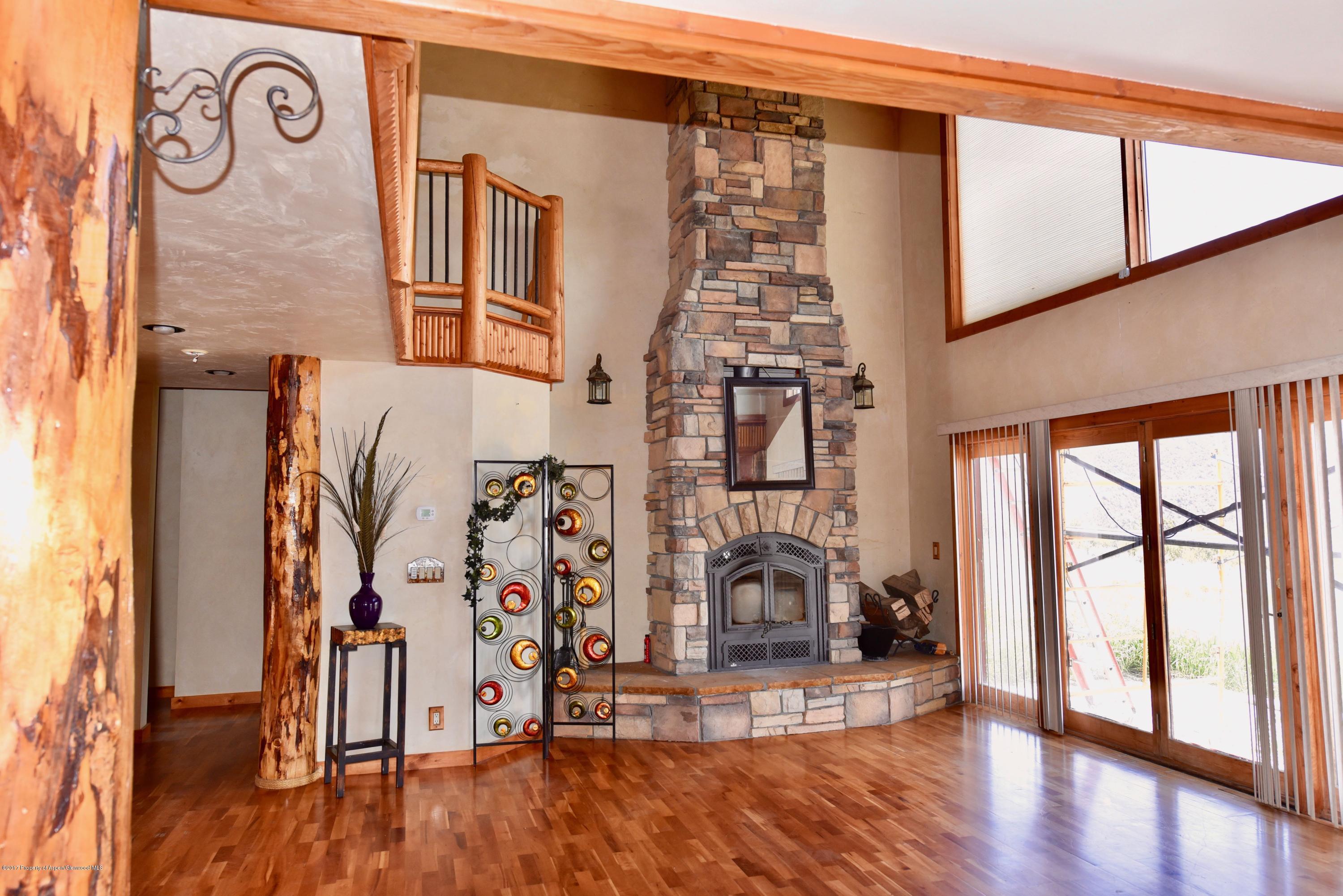 3744 County Road 237 Rifle, CO 81650 - Photo 31 of 37 a view of front door with entryway and wooden floor