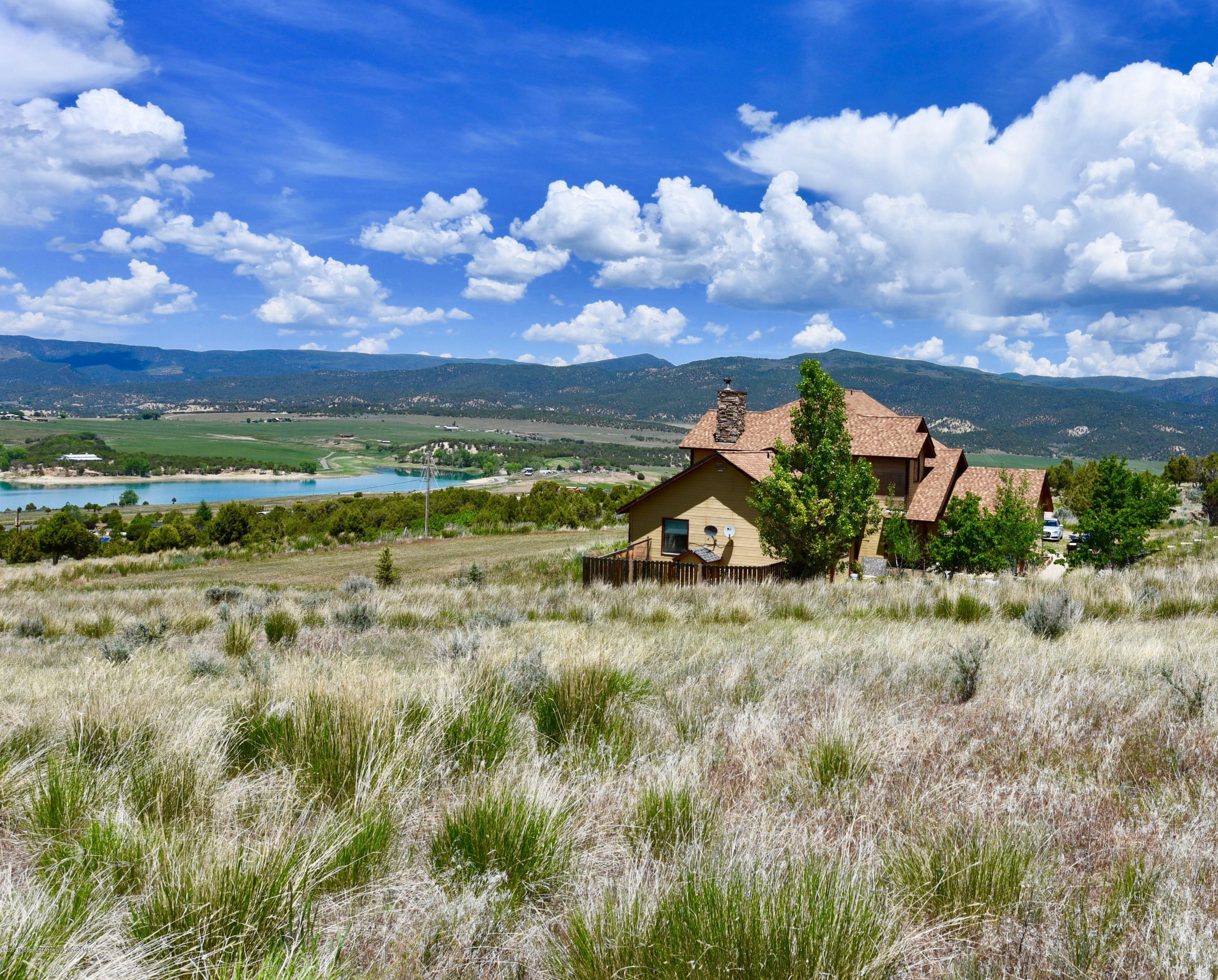 3744 County Road 237 Rifle, CO 81650 - Photo 33 of 37 a view of a lake with a houses