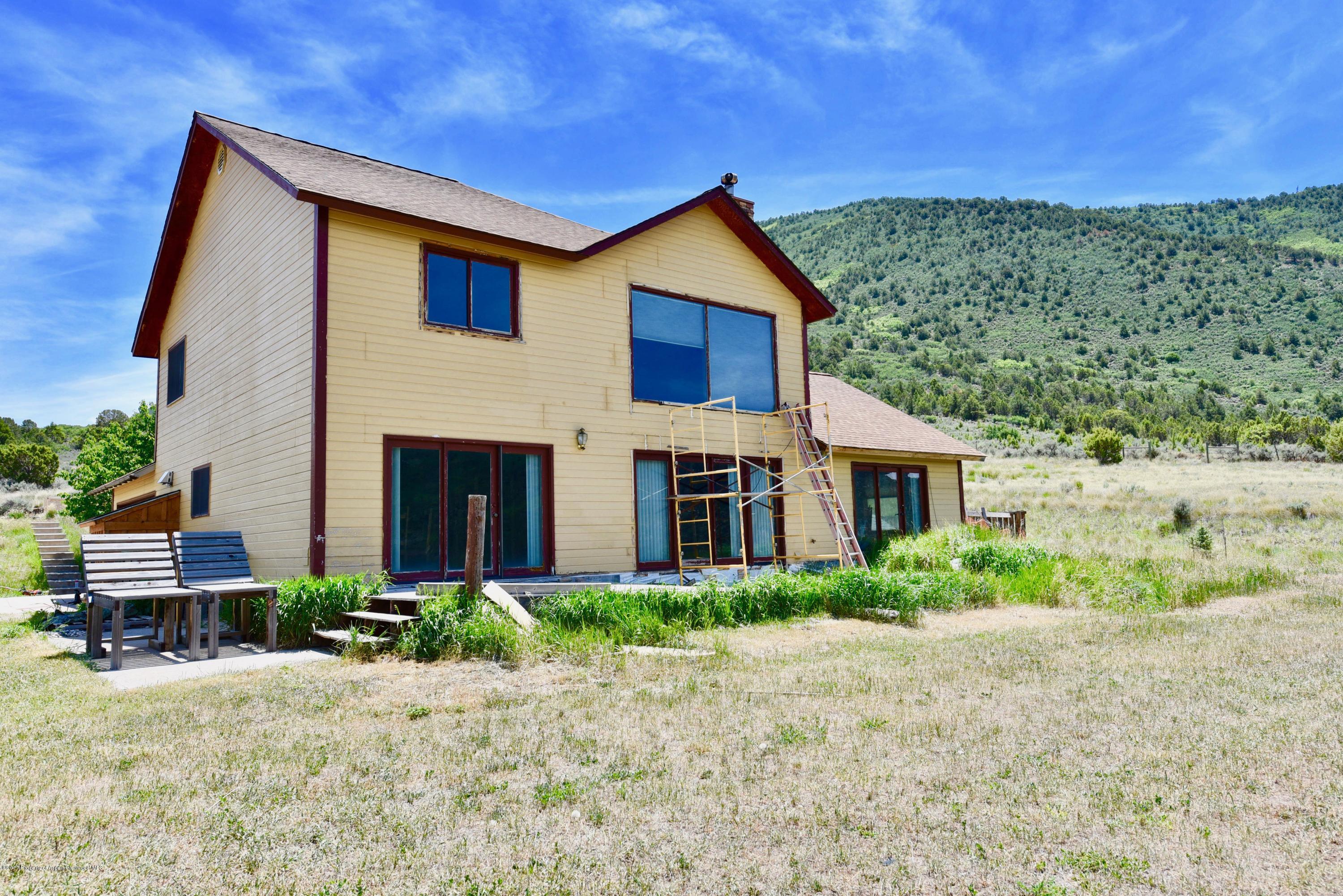 3744 County Road 237 Rifle, CO 81650 - Photo 36 of 37 a front view of a house with a yard