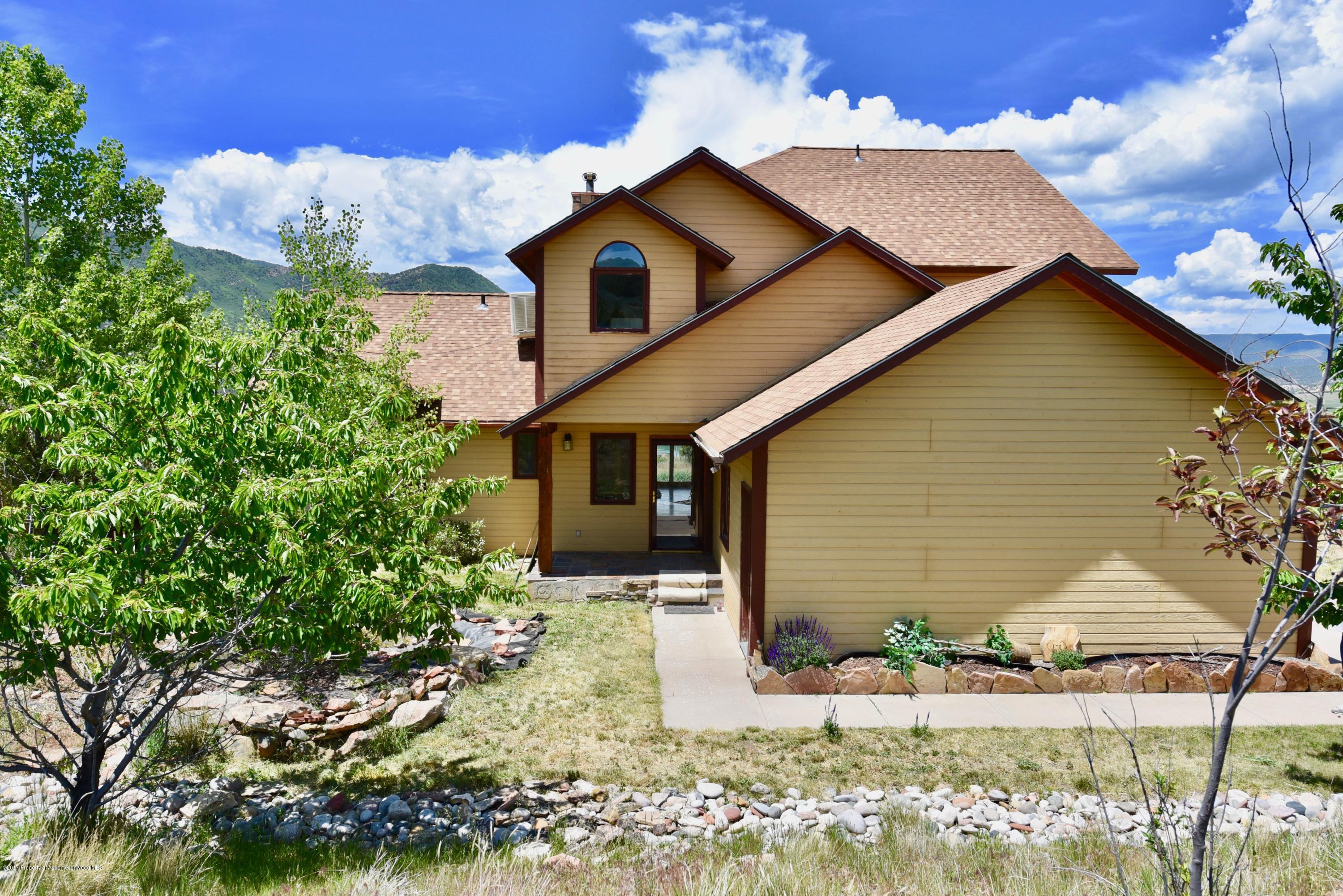 3744 County Road 237 Rifle, CO 81650 - Photo 37 of 37 a front view of a house with garden