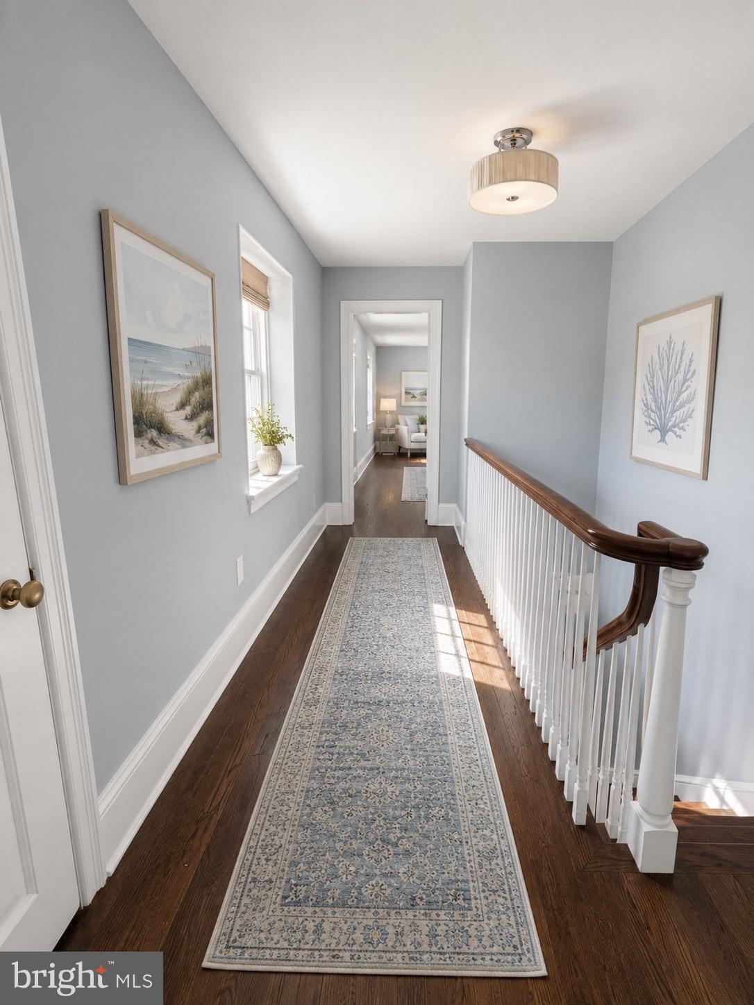504 Conshohocken State Road Gladwyne, PA 19035 - Photo 6 of 20 a view of a hallway to room with wooden floor
