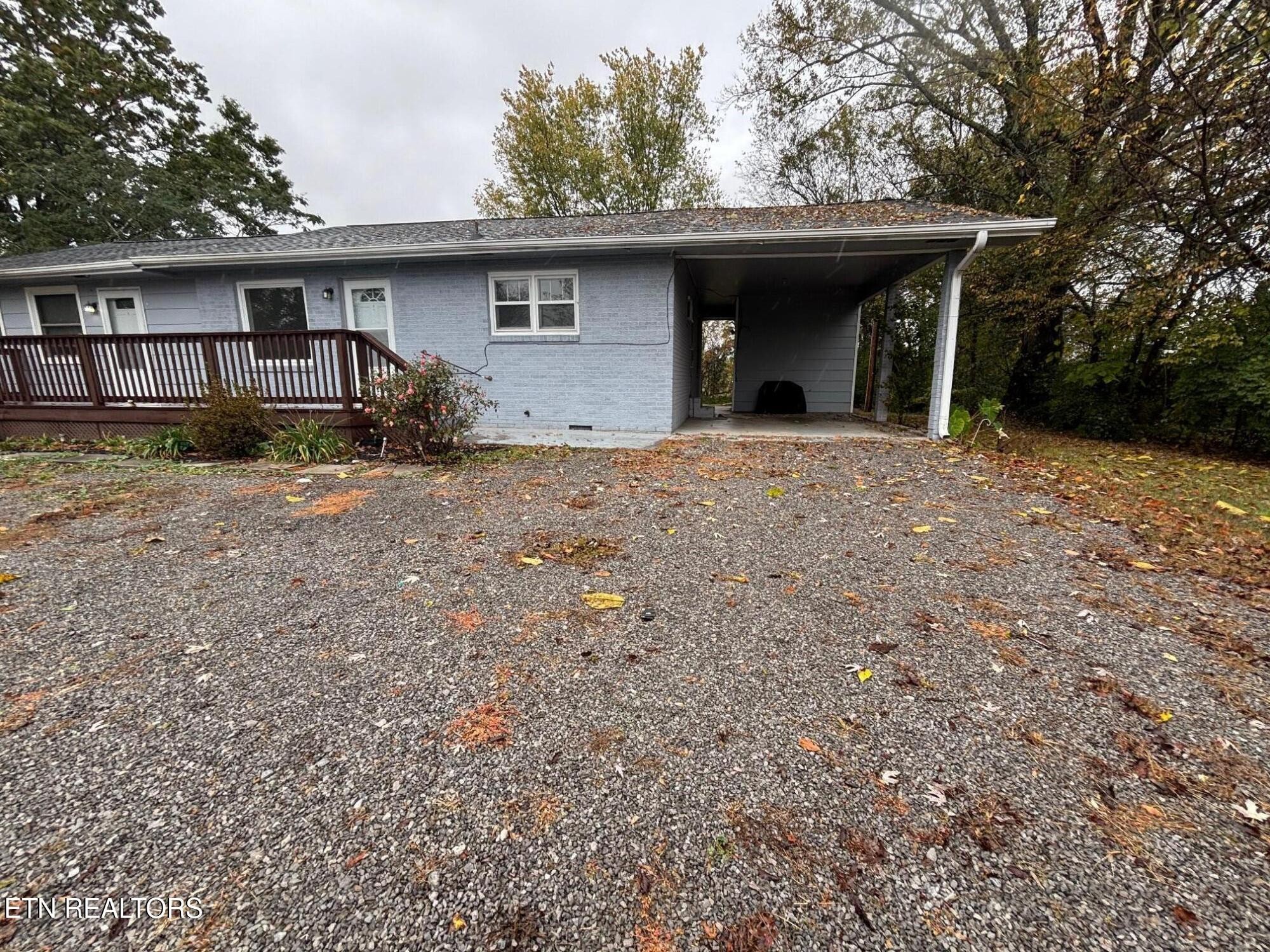7005 Washington Pike, Unit A Corryton, TN 37721 - Photo 1 of 17 a view of a house with yard and garage