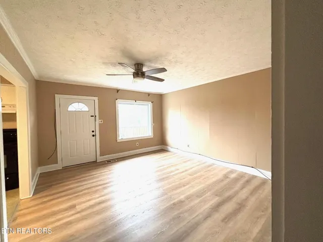a view of an empty room and window