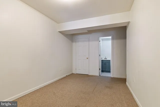 a view of a patio with table and chairs