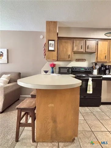 a kitchen with a sink cabinets and window