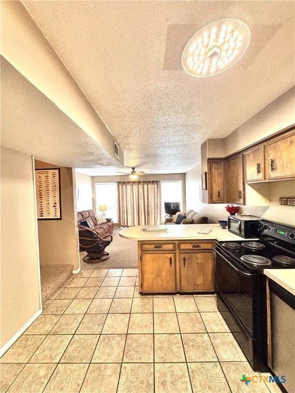 454 15th Street Port O'Connor, TX 77982 - Photo 20 of 45 a kitchen with stainless steel appliances a stove a sink and a refrigerator