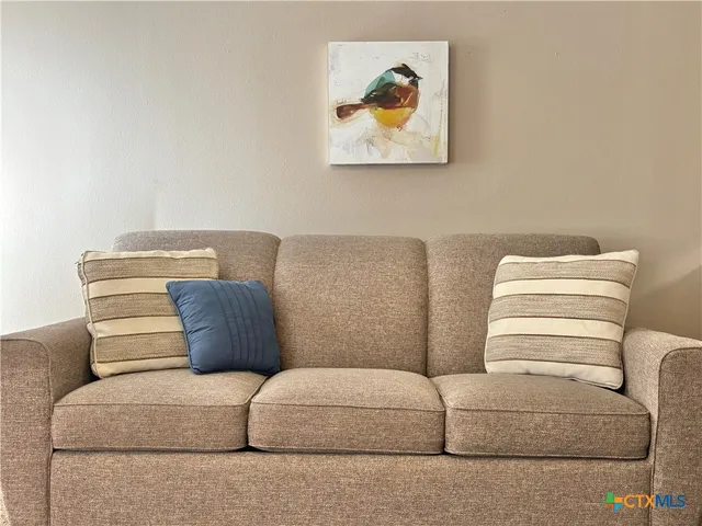 a living room with furniture and a couch
