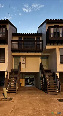 a front view of a house with parking space