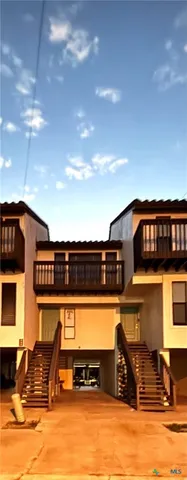 a front view of a building with glass windows