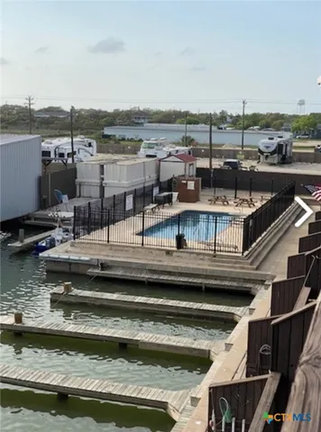 a view of a swimming pool with a lake view