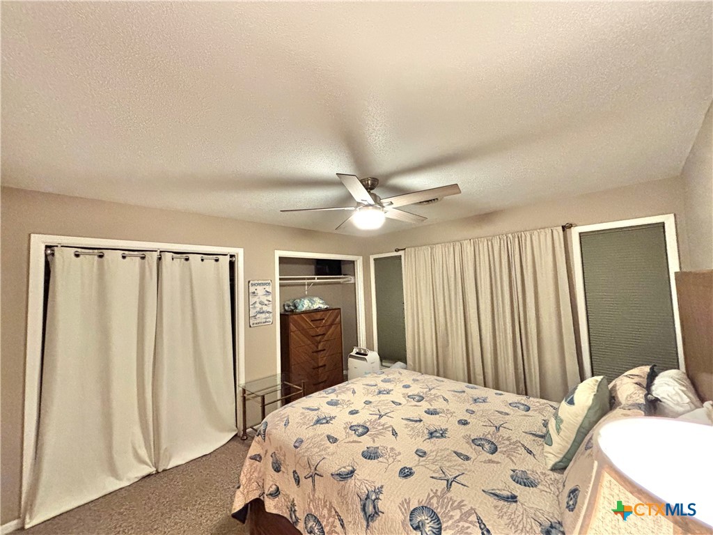 454 15th Street Port O'Connor, TX 77982 - Photo 32 of 45 a bedroom with a bed and a dresser