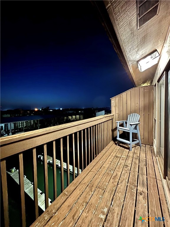 454 15th Street Port O'Connor, TX 77982 - Photo 35 of 45 a view of balcony with wooden floor and fence