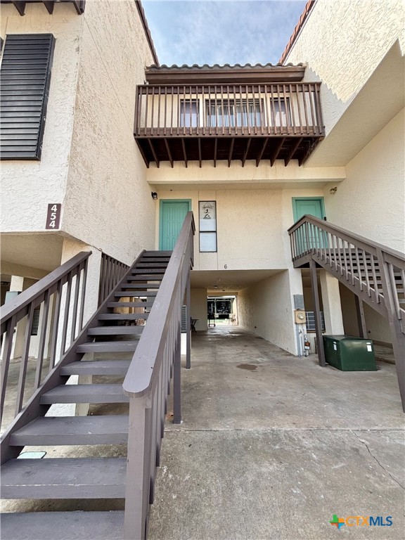 454 15th Street Port O'Connor, TX 77982 - Photo 40 of 45 a view of staircase with lots of frames on wall and a potted plant